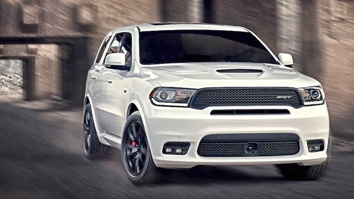Dodge Durango A white Dodge Durango driving through a tunnel