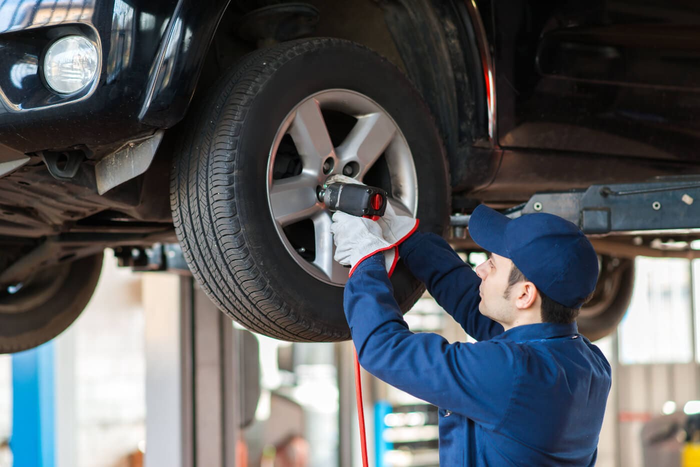Service mechanic working on a tire