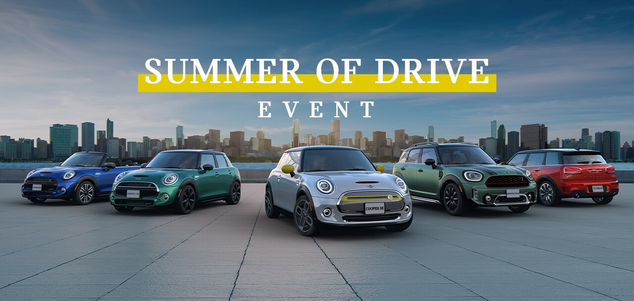 2021 March MINI Offers Summer of Drive - 5 MINI's parked in front of a building.