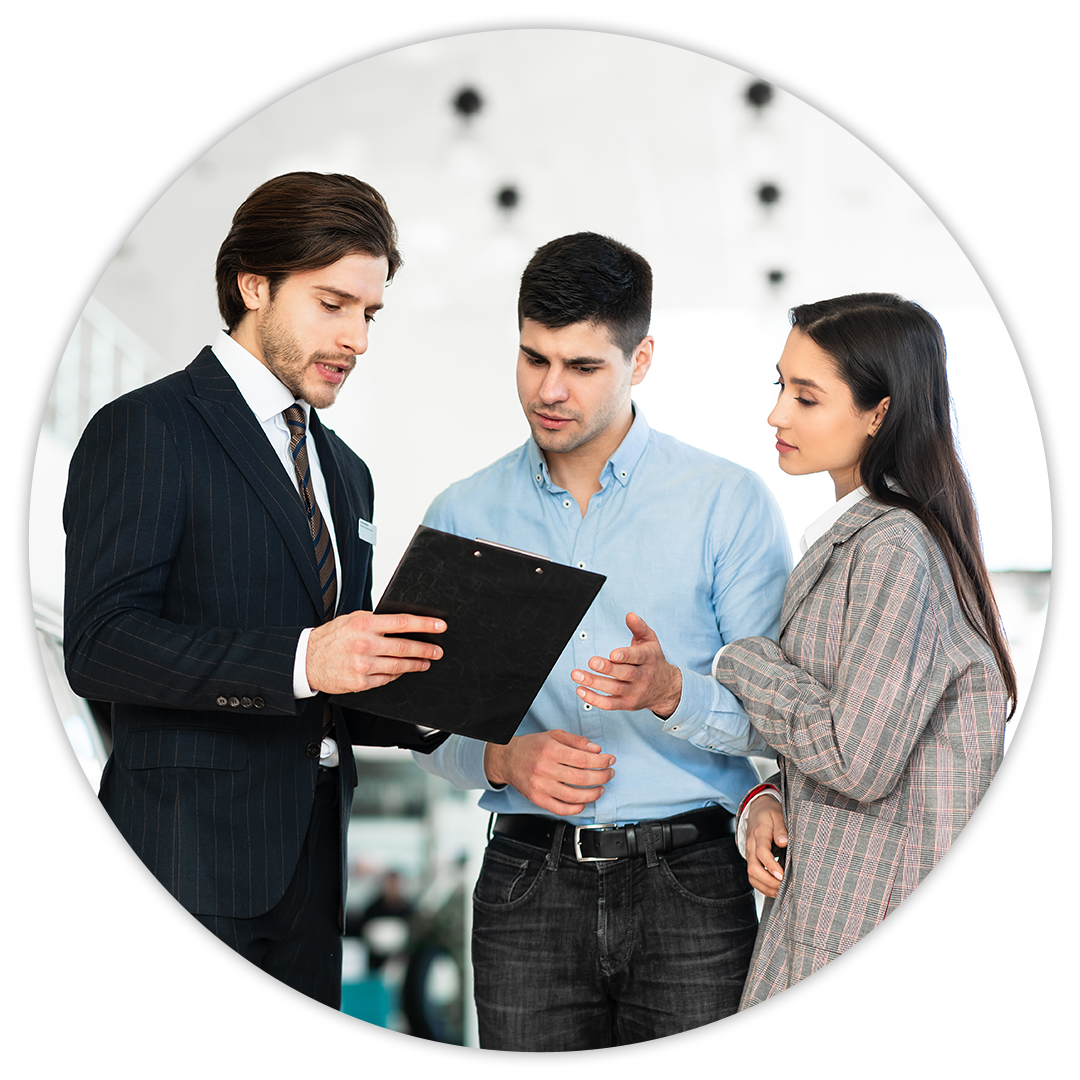 Fast, Simple, Fair Pricing at MINI of Baltimore County | Young Couple Discussing Finances with Sales Advisor