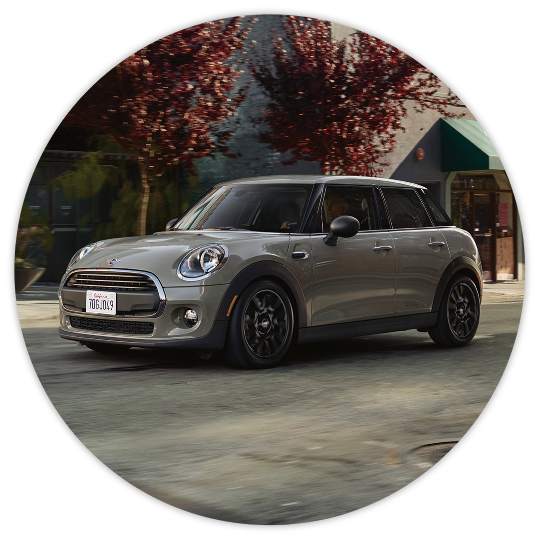 Fast, Simple, Fair Pricing at MINI of Baltimore County | Gray 2020 MINI Cooper Hardtop 4 Door Driving past Red-Tinted Trees