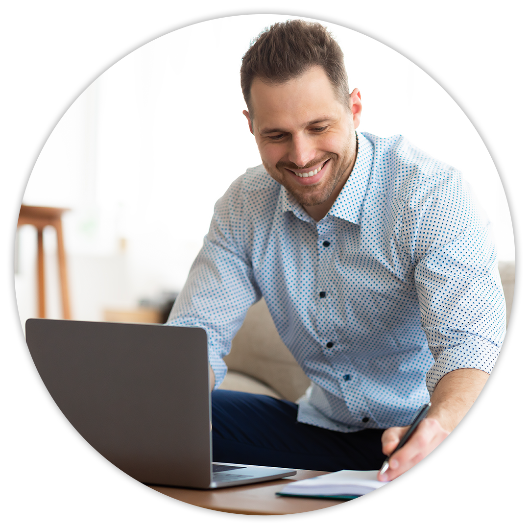 Fast, Simple, Fair Pricing at MINI of Baltimore County | Man Sitting at Home On Laptop Going Over Finances