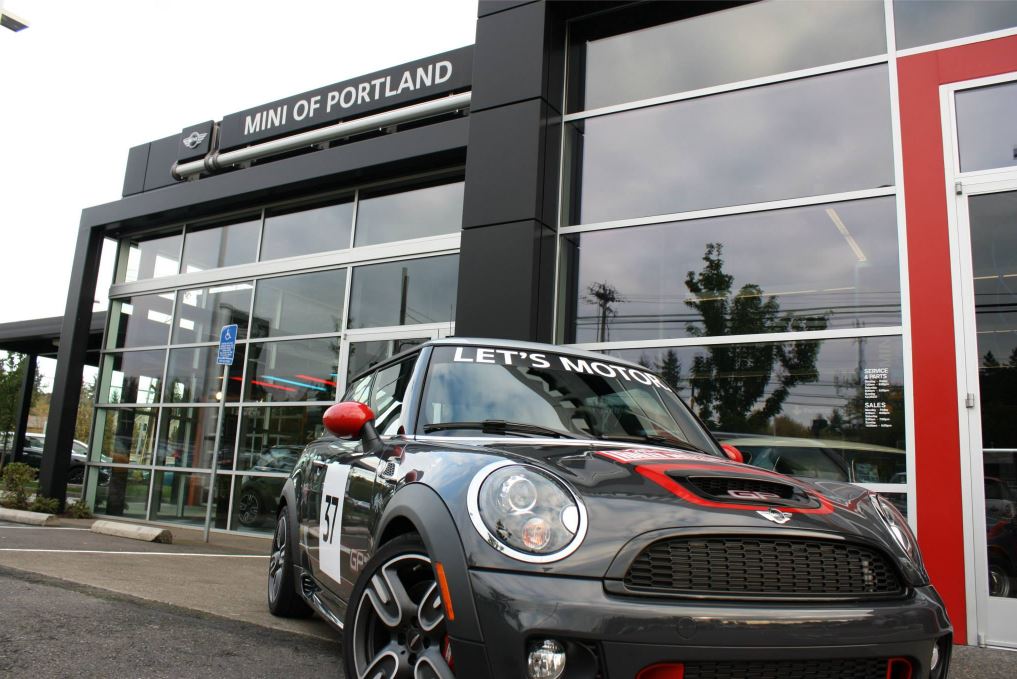 Oregon MINI Society at MINI of Portland A black MINI sitting in front of the MINI of Portland building