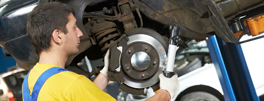 mechanic doing brake repair