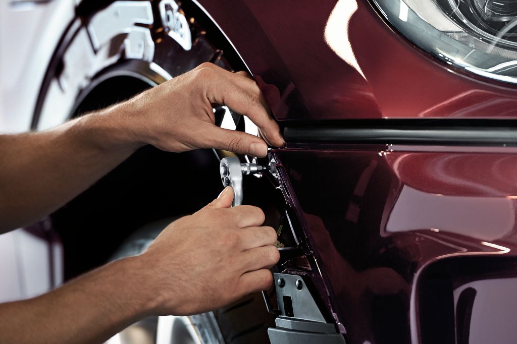 MINI Collision Repair Technician repairing a MINI Cooper