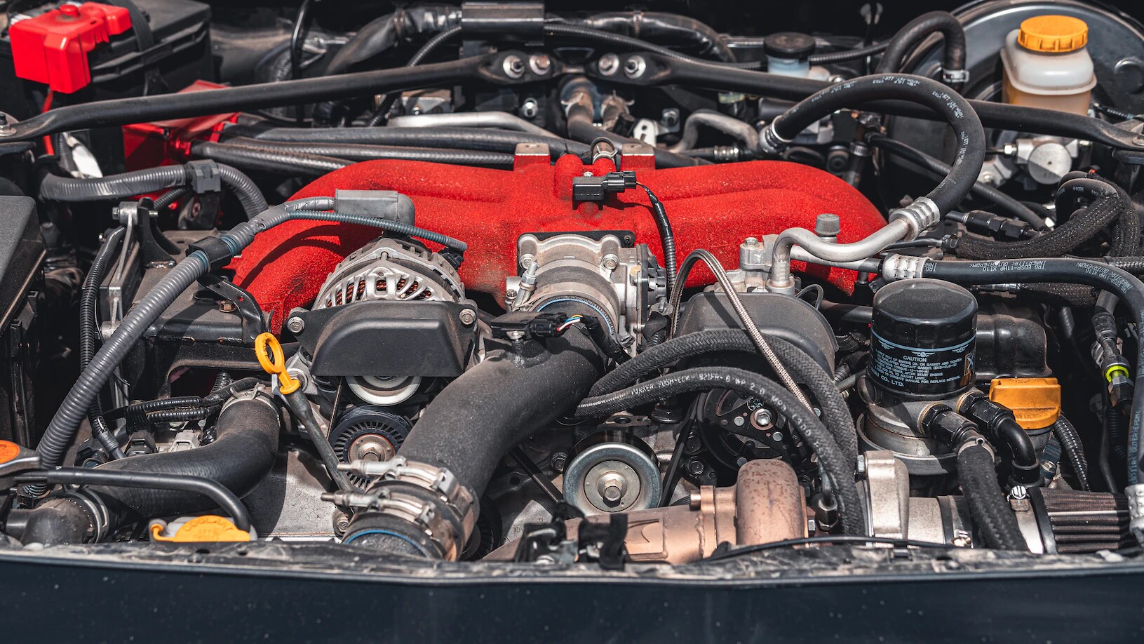2023 Subaru boxer engine with red engine cover repaired at bob Moore Collison center
