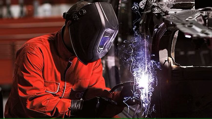 Collison center mechanic welding on Audi vehicle frame