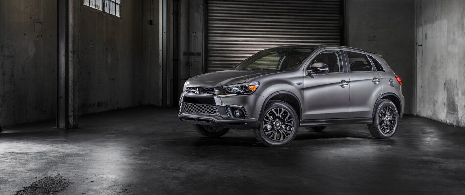 2018 Mitsubishi Outlander Sport A grey Mitsubishi Outlander Sport parked in a dark garage