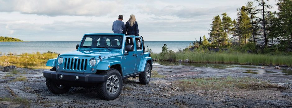 Test Drive a Jeep With Connect Today People sitting on top of the Jeep Wrangler
