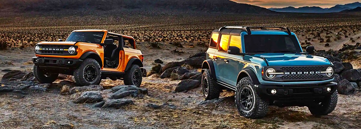 2021 Bronco lineup with sunset background