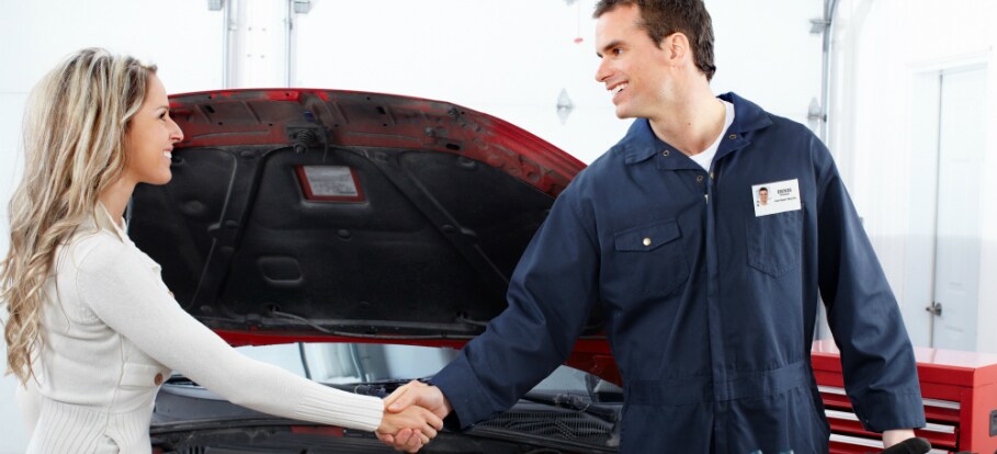 bigstock-Handsome-mechanic-and-client-w-15801074.jpg