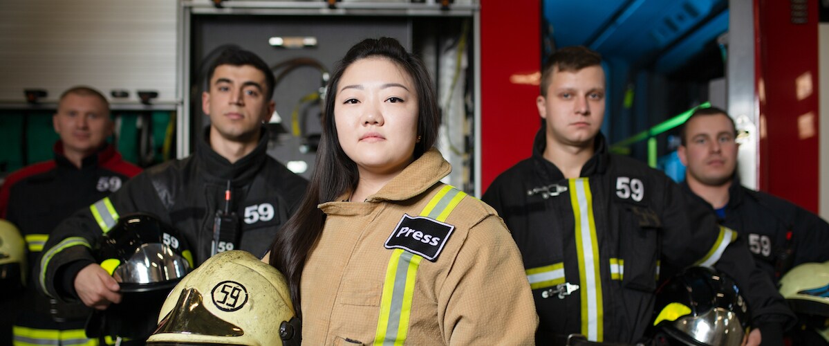 Firemen and women standing in a row