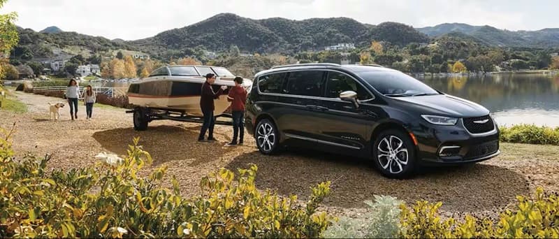 Chrysler Pacifica Towing Capability Chrysler Pacifica Towing a boat alongside a lake