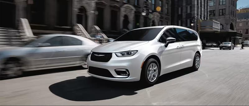 Chrysler Pacifica Performance Chrysler Pacifica in motion driving down busy street