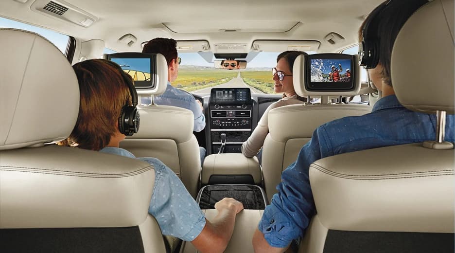 family of four driving in Nissan Armada SUV