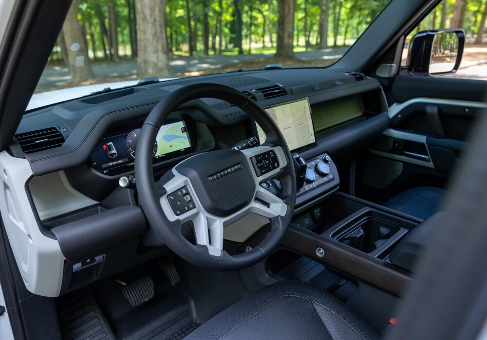 defender-130-interior.png Defender 130 interior. The infotainment system is visible. The interior of the car is black