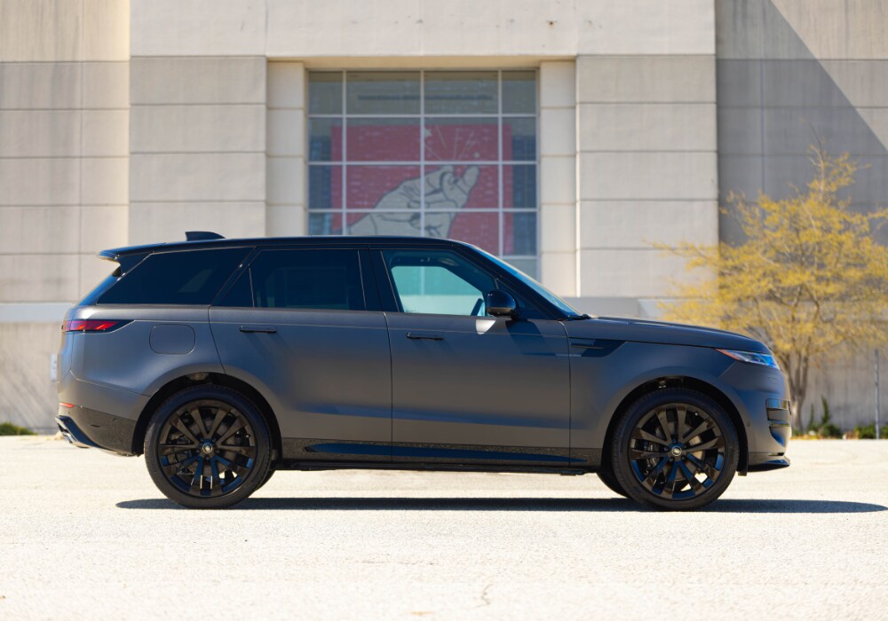 range-rover-sport-for-sale.png Gray Range Rover Sport parked in front of a large beige building in Greensboro, NC