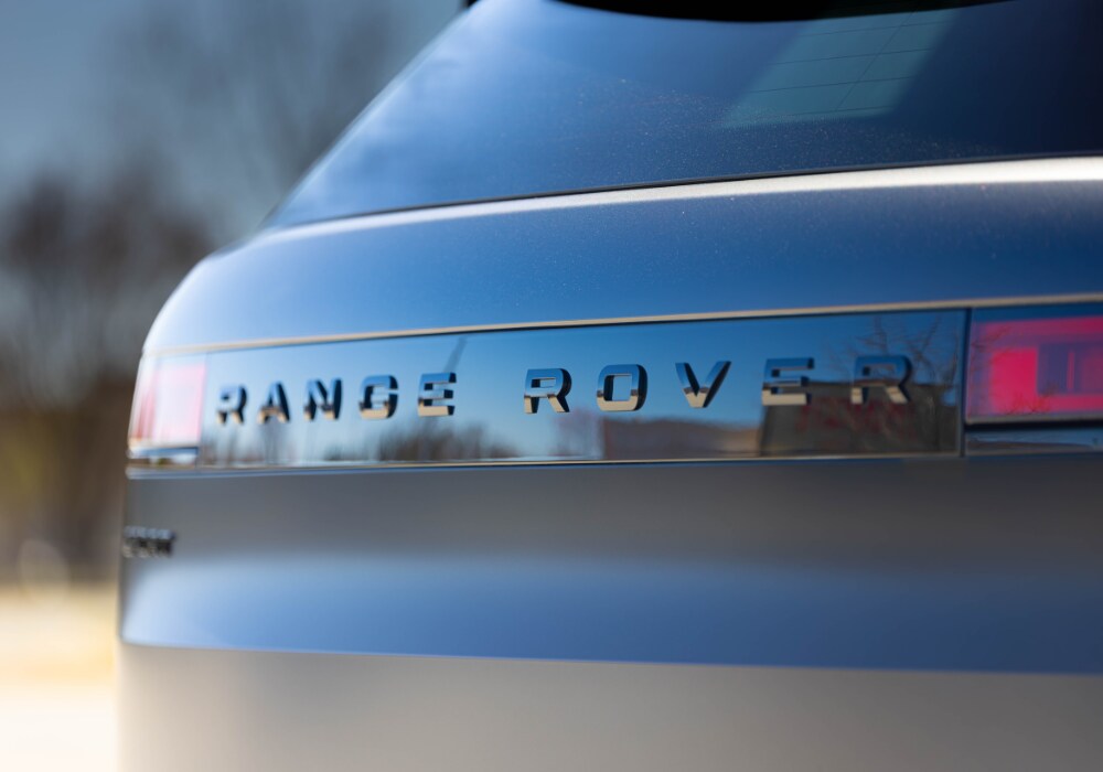 range-rover-sport-2025.png Exterior rear of the Range Rover Sport. The Range Rover logo is visible on the back of the SUV