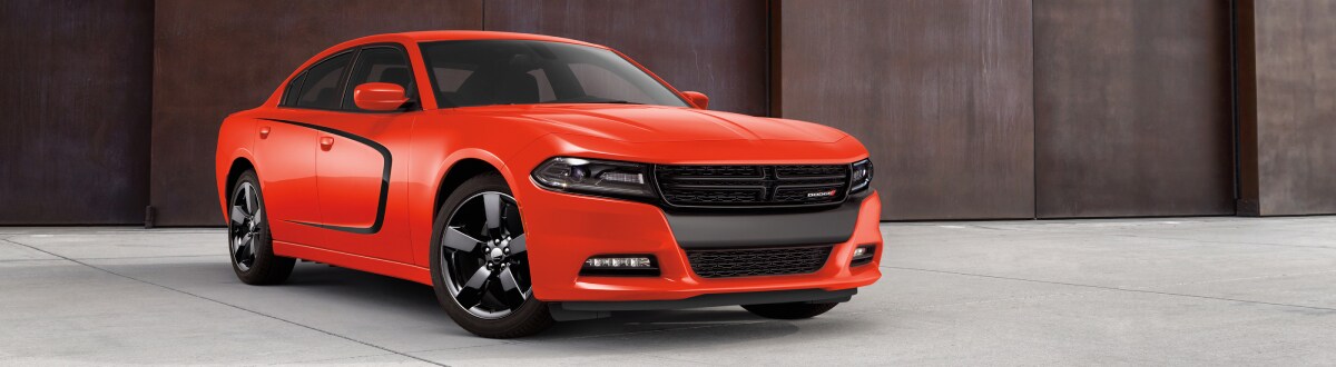 2019-Dodge-Charger-SXT-Sedan-L01 (1).jpg New Dodge Charger in orange outside