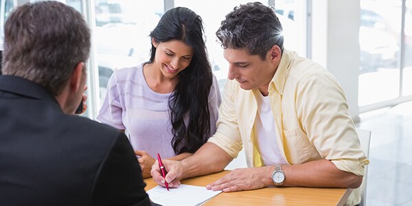 shutterstock_255875752-(2).jpg customer signing finance documents