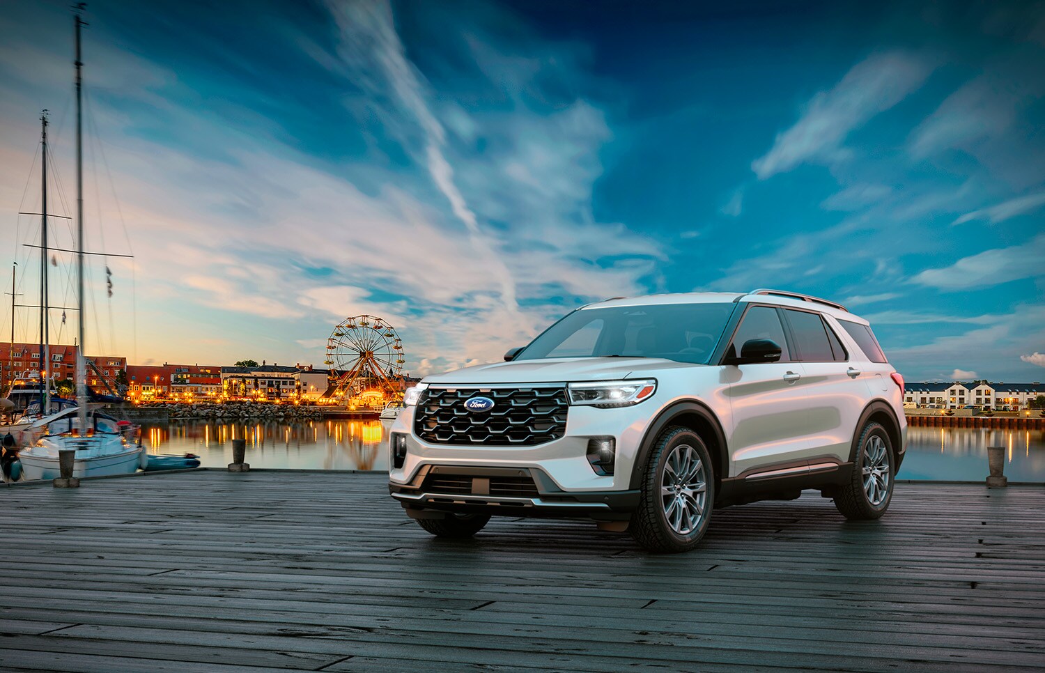 Ford Explorer Platinum SUV parked with water and fair in the background