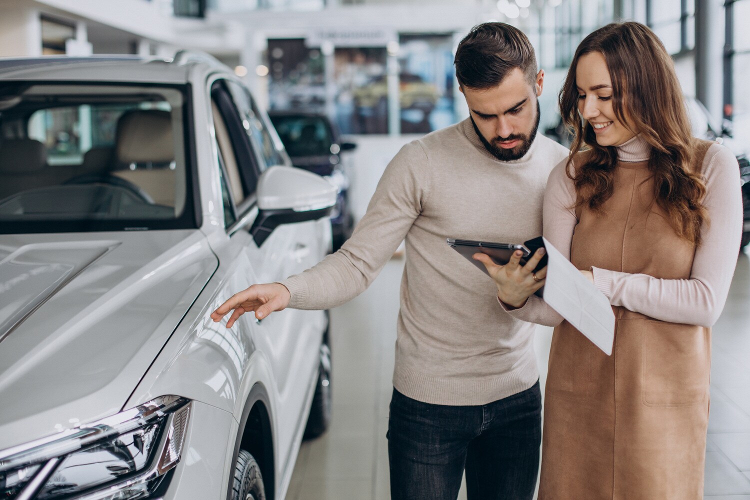 Finance Center Member discussing financing options with customer at New Brighton Ford