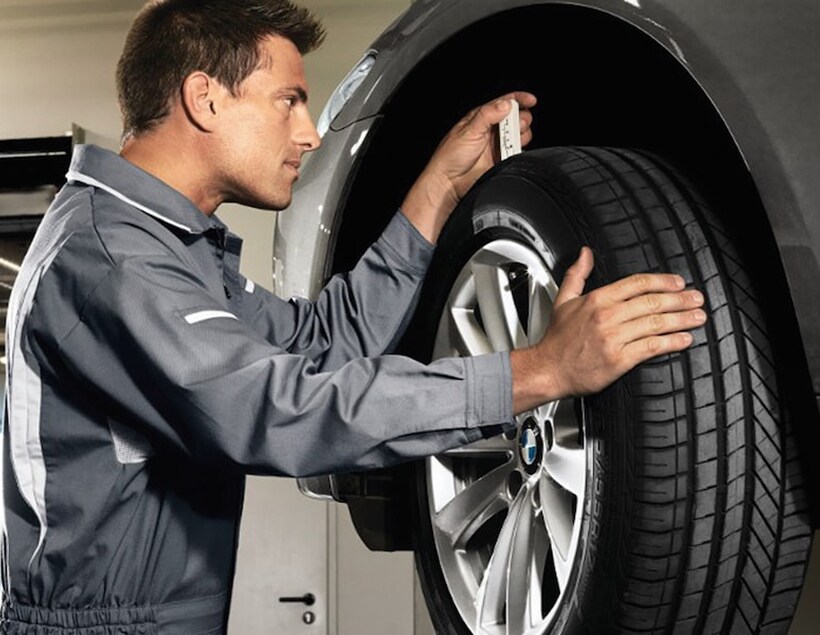 Technician checking wheel depth