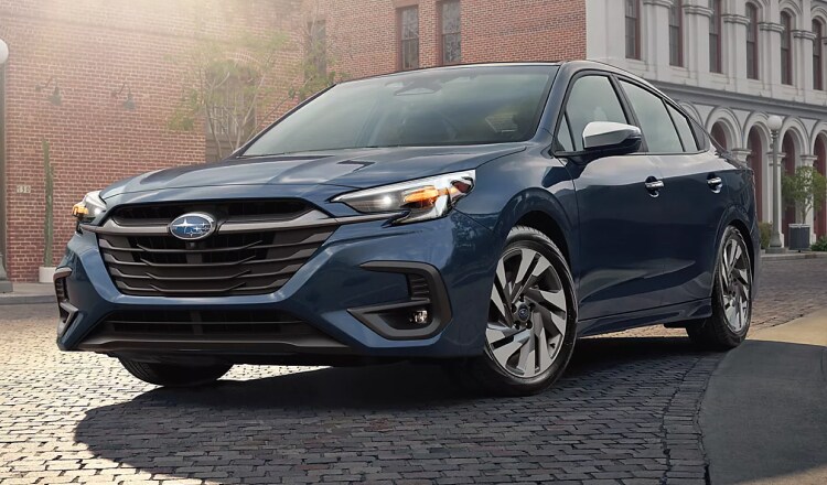 A Blue Lincoln SUV parked at a hanger