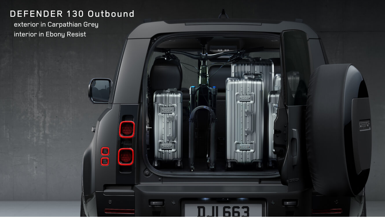 Rear cargo view of a Land Rover Defender 130 Outbound in Carpathian Grey showing Ebony Resist interior.