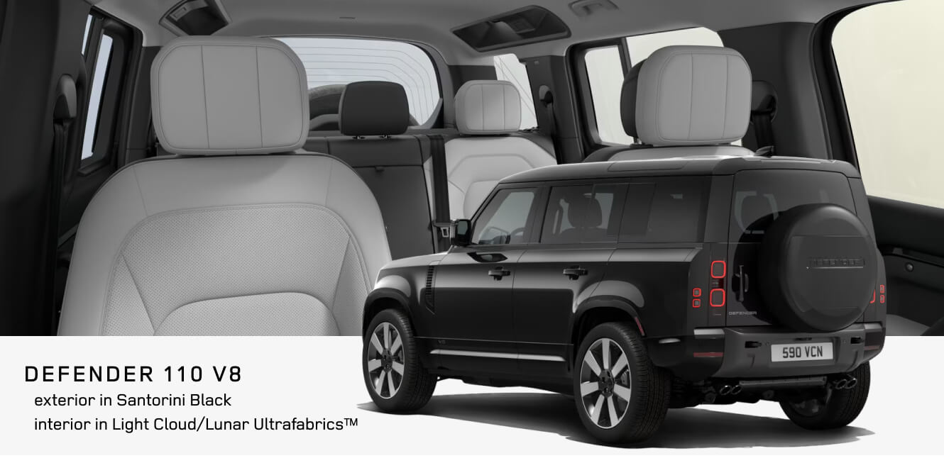 Interior cabin and rear exterior view of a Land Rover Defender 110 V8 in Santorini Black showing Light Cloud and Lunar Ultra fabrics interior.