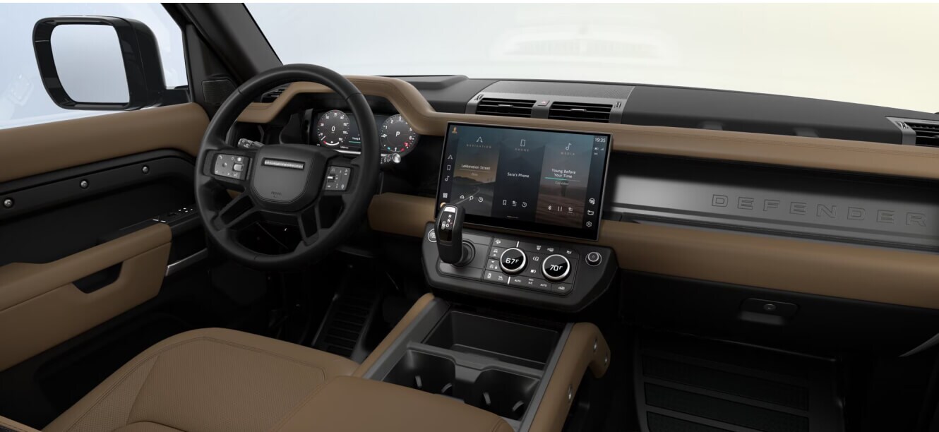 Interior dashboard view of a Land Rover Defender 90 Vertex showing Caraway and Ebony Windsor leather interior.