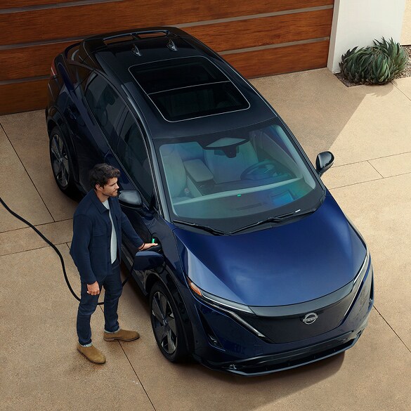 Nissan LEAF driving along a coastal road