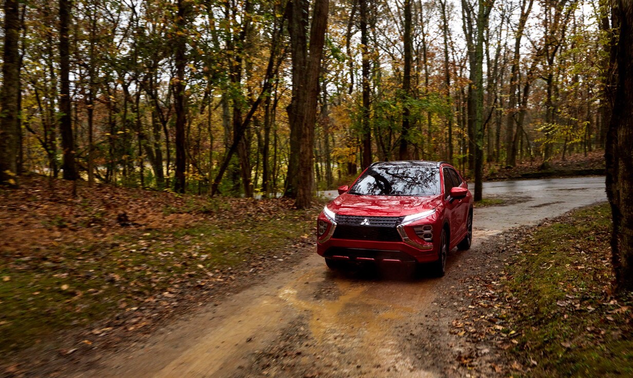 2022 Mitsubishi Eclipse Cross In Red Driving In Woods 2022 Mitsubishi Eclipse Cross In Red Driving In Woods