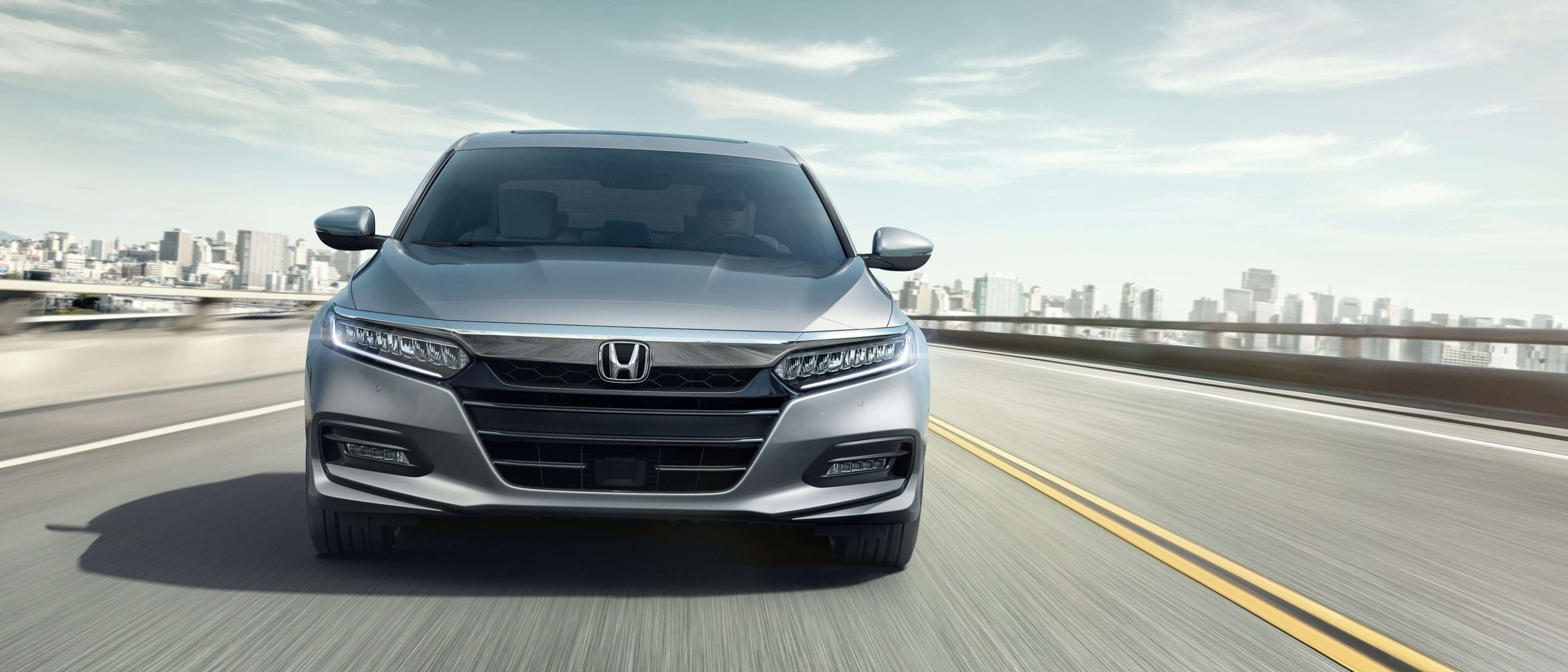 2020 Honda Accord in Silver view from head on while driving on the highway