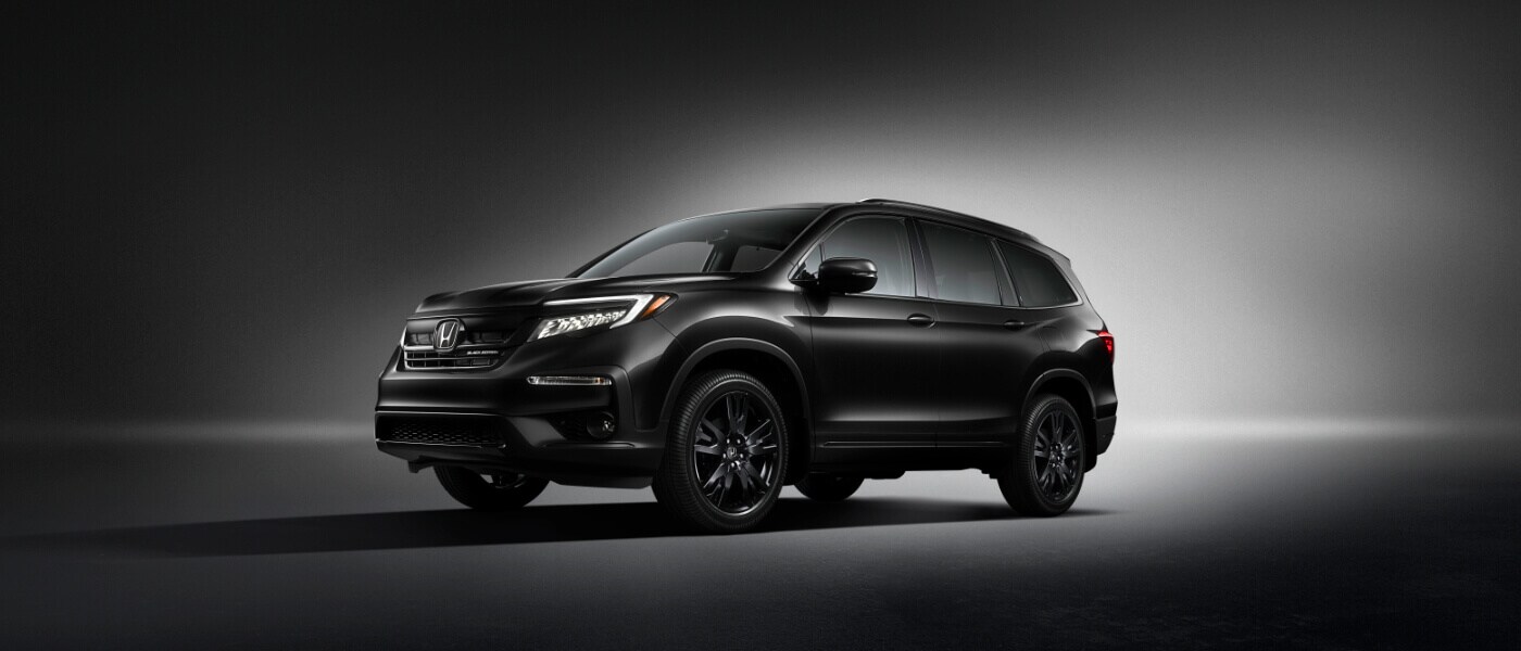 2020 Honda Pilot in black parked in dark room