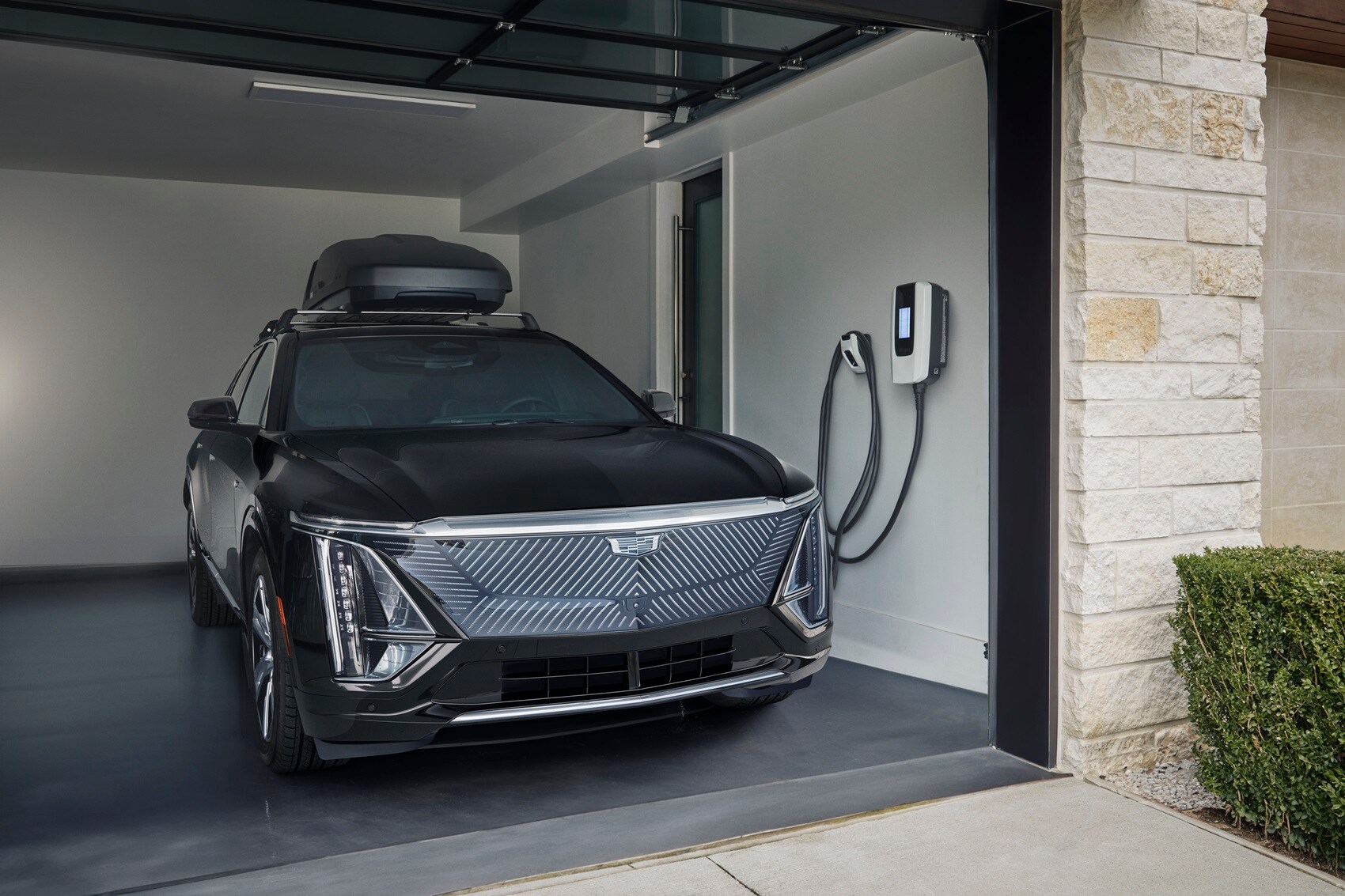 Cadillac Lyriq charging inside a home garage
