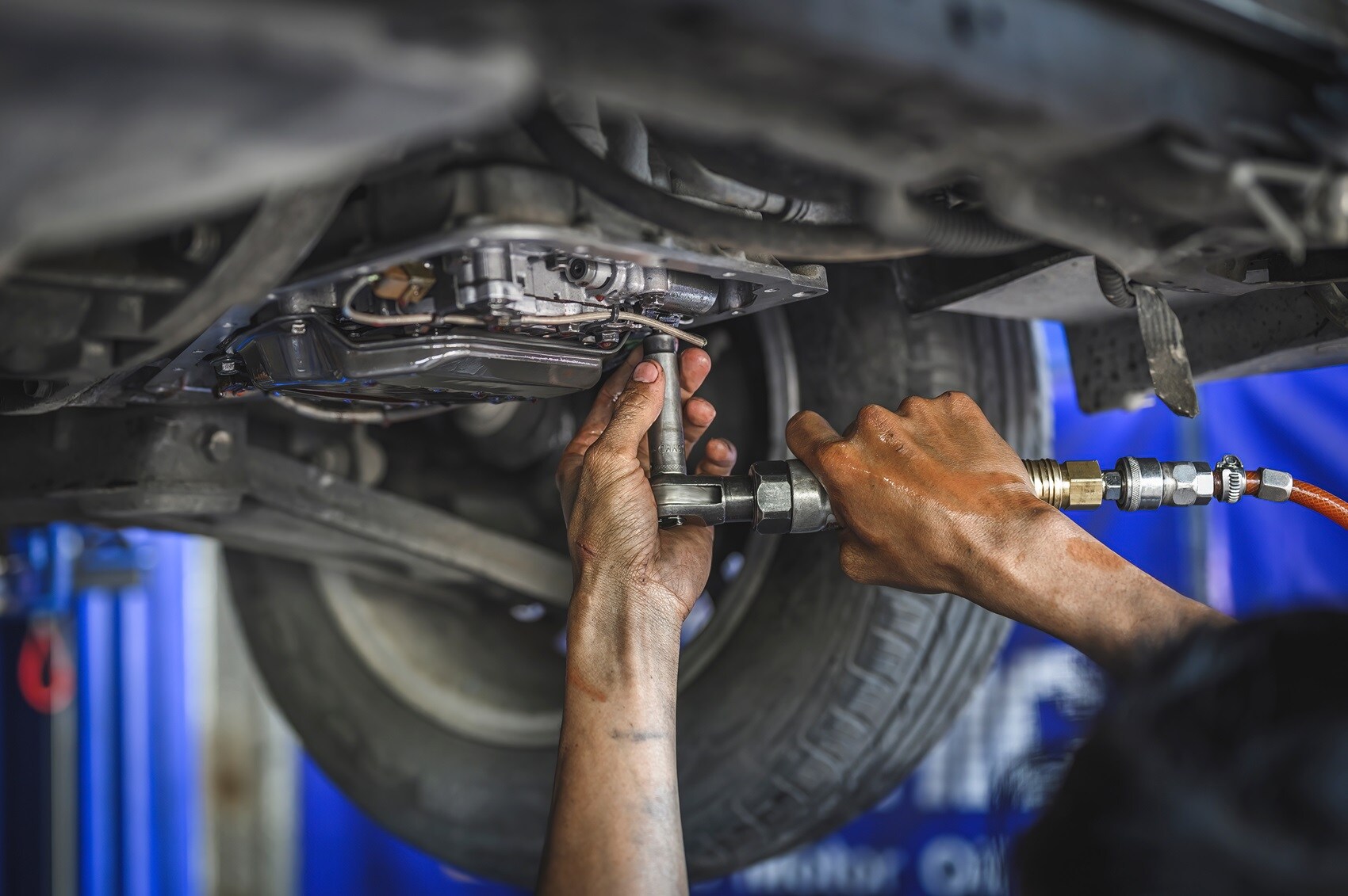 Cadillac Certified Technician working on vehicle