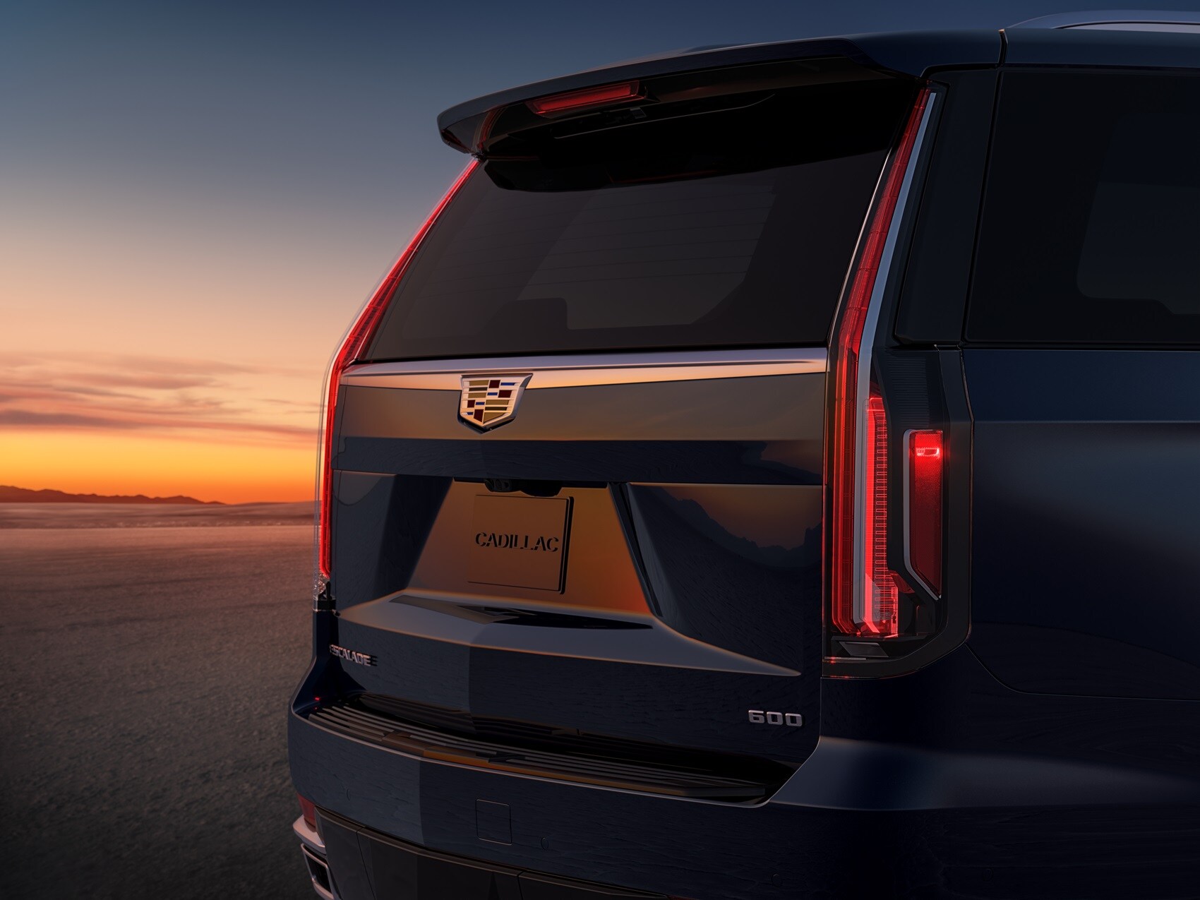Back of Cadillac Escalade with sunset in the background