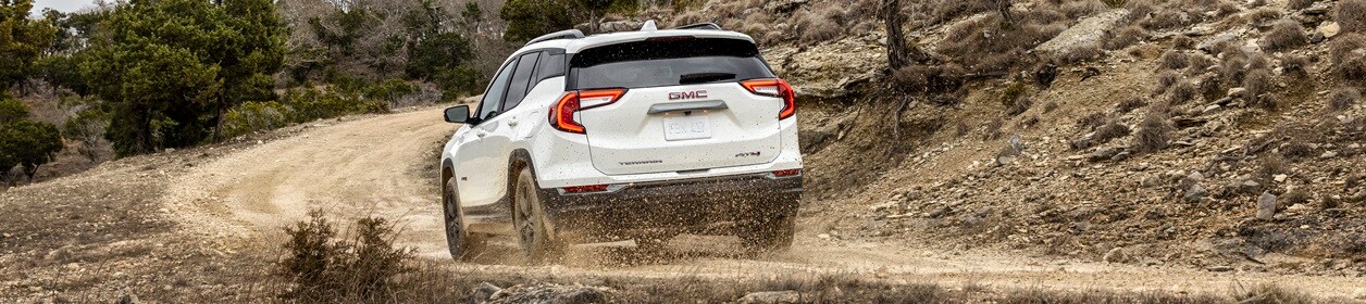 GMC Terrain SUV driving through scenic route