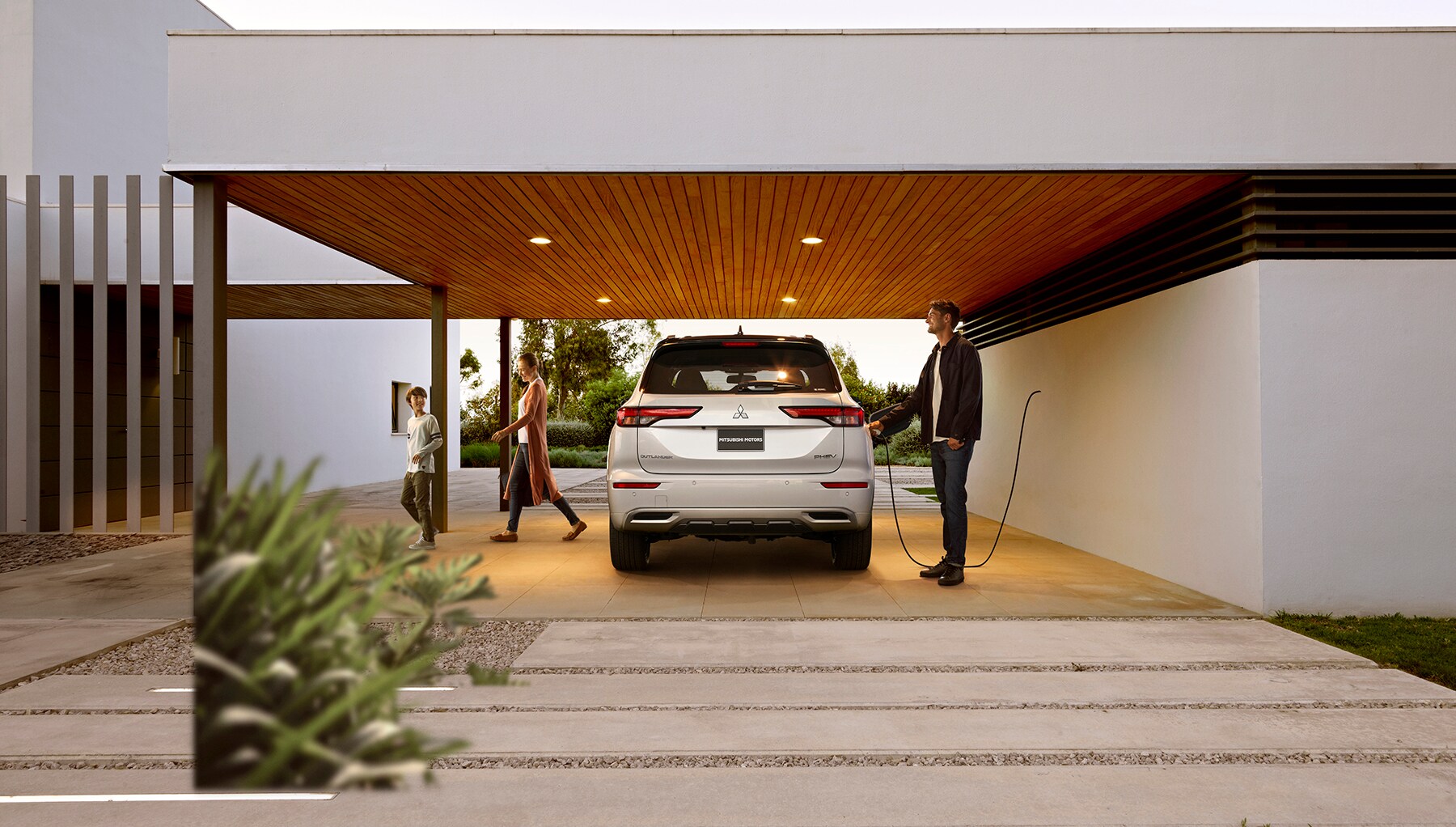 2023 Outlander PHEV SEL Premium Rear Photography Residential Lifestyle.jpg