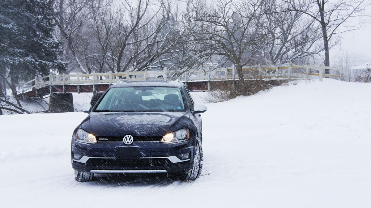 VW Alltrack in the Snow with Bridge.jpg