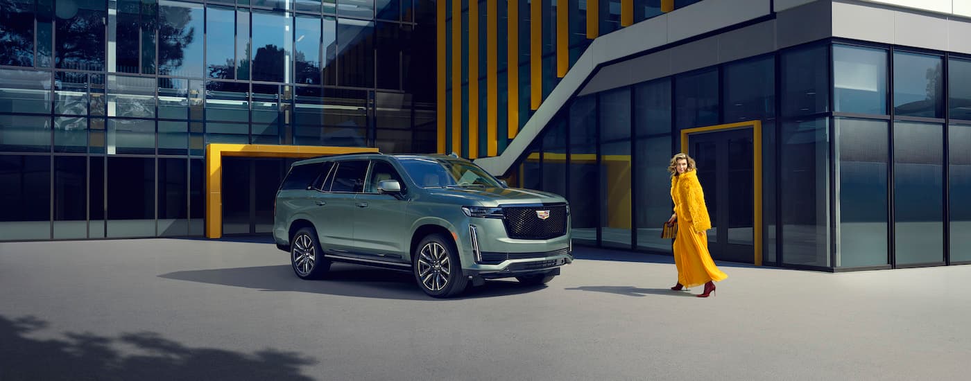 A green 2024 Cadillac Escalade from the front at an angle.