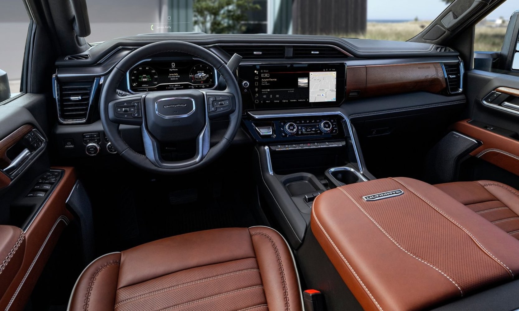 Interior view of the dashboard inside a 2024 GMC Sierra 2500 HD Denali Ultimate from the driver seat point of view