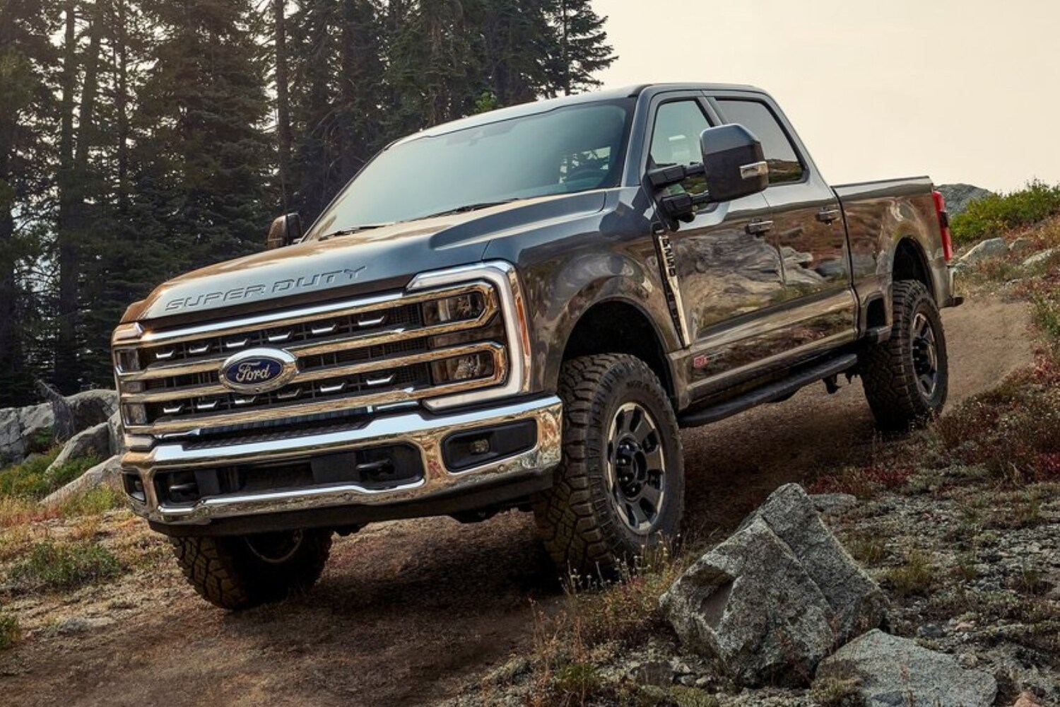New 2023 Ford F-250 Super Duty Tremor Truck Comparison - Octane GMC of Santa Fe.jpg 2023 Ford F-250 Super Duty Tremor Package driving down an off-road hill