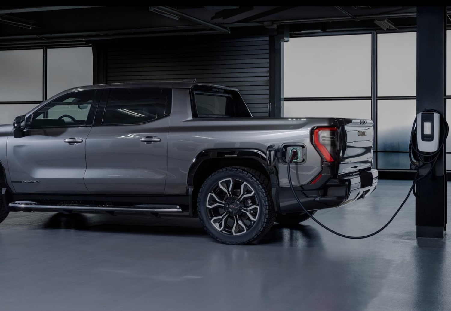 2024 GMC Sierra EV Charging at a station