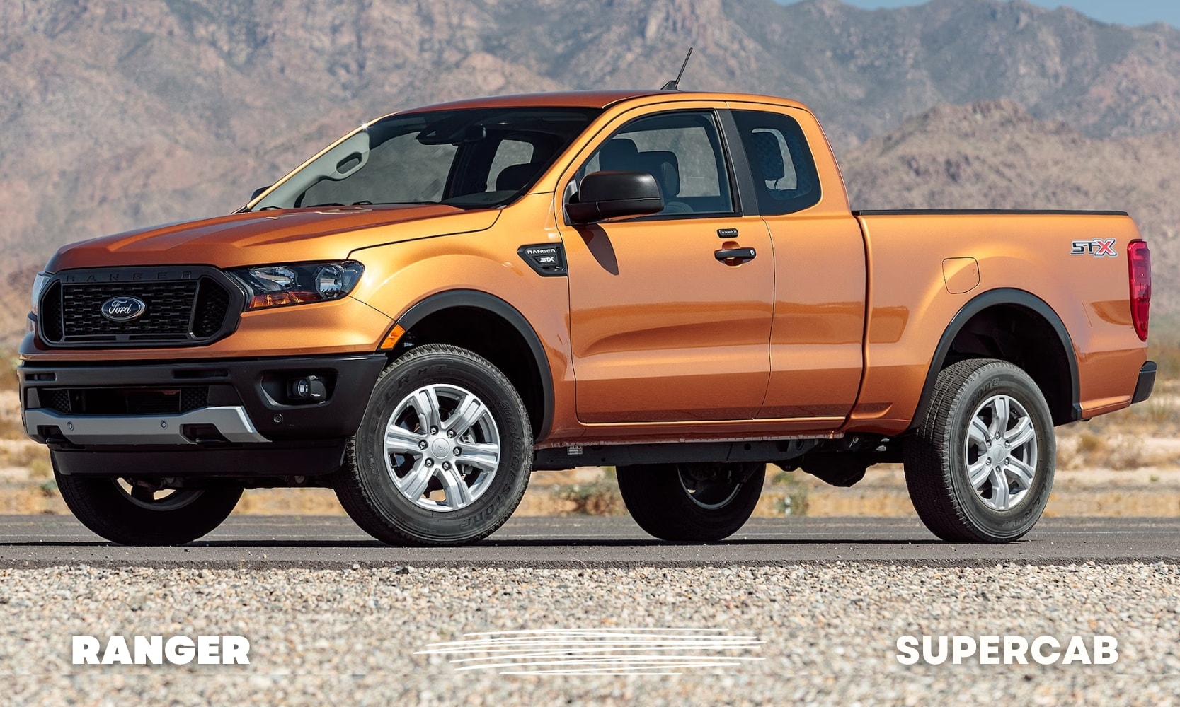 Driver side exterior view of an orange Ford Ranger truck with a SuperCab cab configuration