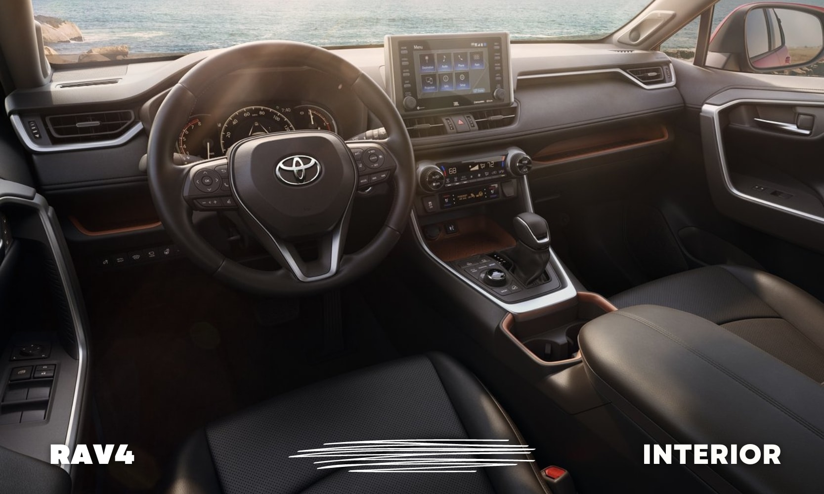 a clean, modern, black leather interior of a used Toyota RAV4 SUV