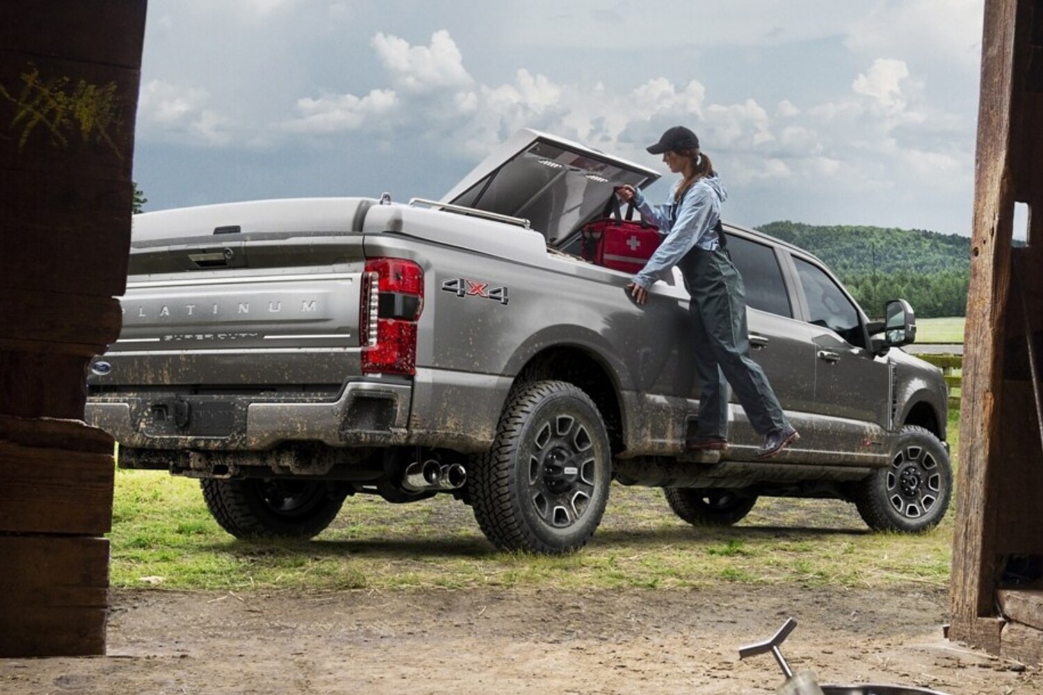New 2023 Ford F-250 Super Duty Platinum Truck Comparison - Octane GMC of Santa Fe.jpg 2023 Ford F-250 Super Duty Platinum Truck outside a barn with gear being loaded into the truck bed