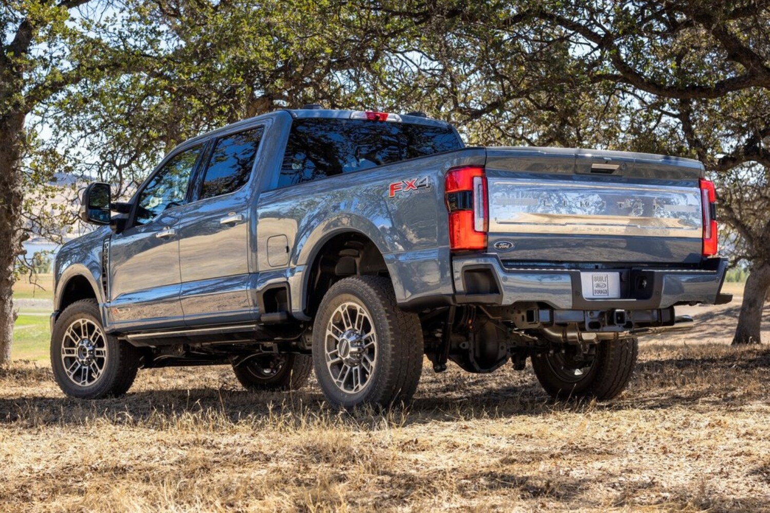 Rear exterior view of the 2023 Ford F-250 Super Duty truck in light blue exterior color