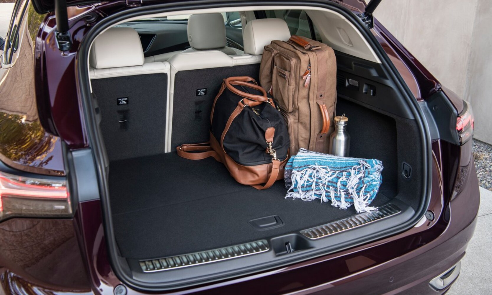 2022 Buick Envision Cargo Space Comparison - Octane Buick GMC of Santa Fe.png Rear cargo space area inside the 2022 Buick Envision compact SUV